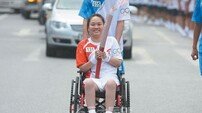 ‘기적의 휠체어’ 올림픽 속으로…다이빙 사고 전신마비된 동밍