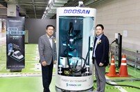 두산로보틱스, 협동로봇 활용한 전기차 자동 충전 솔루션 시범 운영 개시
