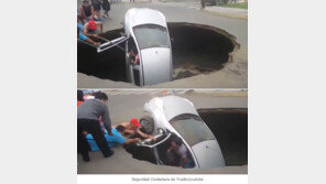 싱크홀에 빠진 차…시민들, 탑승한 일가족 필사적으로 구조