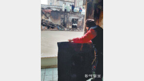 “설 대목인데… 손님 발길은 뜸하고 굴착기 소음만”