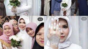 ‘인니 여객기 추락’ 희생자 약혼녀, 결혼식날 홀로 웨딩촬영…“널 위해 웃고있어”