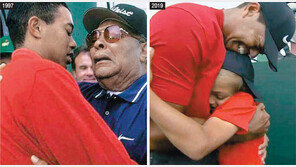 아버지에 안겼던 우즈, 아버지가 돼 우승 포옹