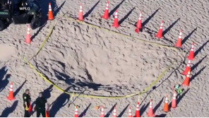 美해변 모래구덩이 파고 놀던 남매 매몰…7세 사망 참사