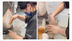 컵에 맨손 넣더니 밀크티 휘휘…中 체인점 위생 논란