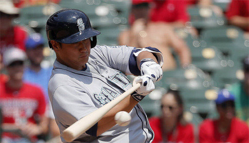 Seattle Mariners first baseman Dae-Ho Lee reacts after a ball hit