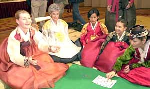 Foreigners enjoy playing `<em>yut</em>`