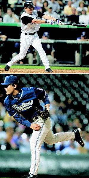 Colorado Rockies starting pitcher Sun-woo Kim of South Korea throws the bat  at a pitch from San Diego Padres starting pitcher Brian Lawrence to connect  for a single to drive in a