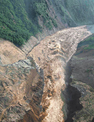 Muddy Water Flowing in Dammed Lake