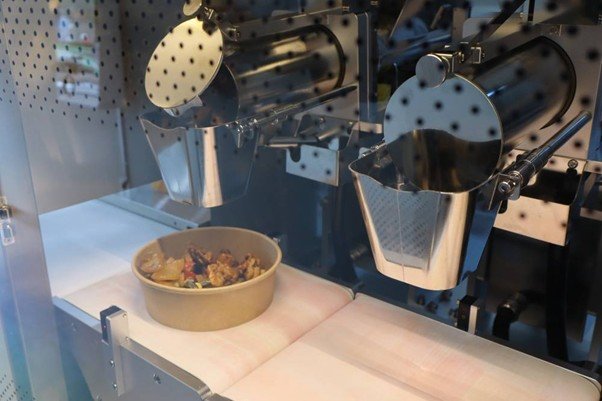 RONIK designed the AI Dispenser CUBE to store ingredients warmly, tailored for SEULTACO / Source=IT DongA