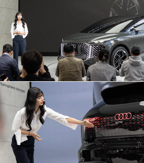 박슬아 디자이너가 2022년 10월 아우디 브랜드 전시관인 ‘하우스 오브 프로그래스 인 서울’에서 자신이 디자인한 차에 대해 설명하고 있다. 헤드램프가 사람의 눈처럼 강렬하다. [아우디코리아]