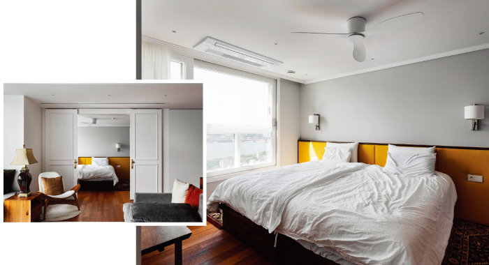 패브릭 소재의 옐로 컬러 침대 헤드가 눈을 사로잡는 부부 침실. 평소에는 침실 문을 활짝 열고 거실과 한 공간처럼 사용한다.