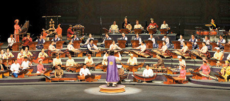 Harmonious Chords:Traditional musicians of Korea and Southeast Asia strike a colorful chord at the International Convention Center, Jeju, a day before the opening of the summit. The ASEAN-Korea Traditional Music Orchestra consists of 80 musicians from Korea and the ASEAN nations. Seogwipo=Yonhap