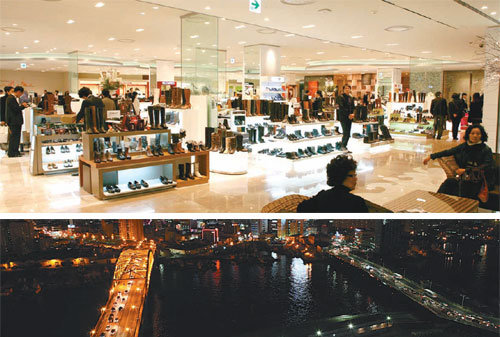 GE라이팅코리아가 부산 롯데백화점 광복점에 설치한 ‘울트라’(위)는 소모 전력을 기존 조명의 절반으로 줄였다. 아래는 백화점 옥상에서 본 부산 야경. 오른쪽 영도대교에는 전력 소모를 줄인 새로운 가로등 ‘크룩스’가 설치됐다. 멀리서 보면 왼쪽 부산대교 가로등보다 어둡지만 실제 그 아래는 더 밝아 사물을 쉽게 알아볼 수 있고 소모되는 전력도 적다. 사진 제공 GE라이팅코리아