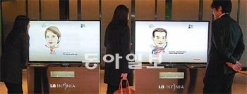 Art and Seoul   The caricatures of  all chief executives 
participating at the B20 summit on display at the  Walkerhill Hotel. The
 caricatures, by The Dong-A Ilbo’s in-house artist Choi Nam-jin, 
appeared on four 55-inch television terminals. The pictures shown are of
 Laurence Parisot, president of MEDEF (left) and Rajeev Singh-Molares, 
executive vice president of Alcatel-Lucent. The organizing committee 
plans to load the pictures onto Samsung Electronics＇ Galaxy Tab 
smartphones and give them as gifts to participating chief 
executives.Photo: Park young-dae