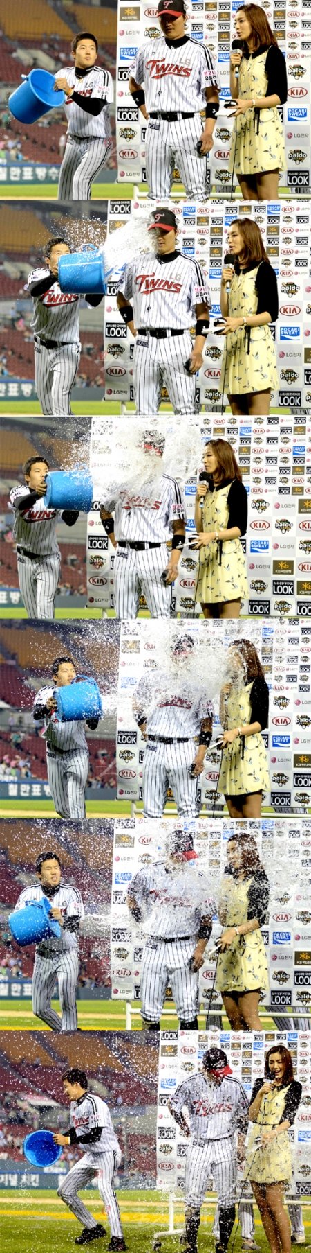 LG 이진영이 KBS N 정인영 아나운서와 인터뷰를 하는 가운데 임찬규가 물세례를 날리고 있다.

잠실｜박화용 기자 inphoto@donga.com 트위터 @seven7sola