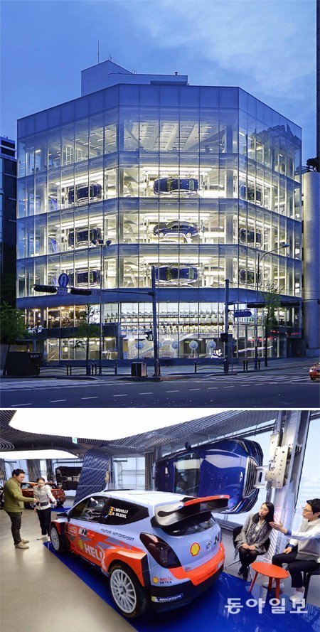 9일 문을 여는 ‘현대 모터 스튜디오 서울’ 전경. 실내에 ‘신형 제네시스’ 9대를 매달아 외부에서도 눈에 띄도록 했다(위쪽 사진). 스튜디오 5층에는 세계랠리챔피언십(WRC) 참가용으로 개조한 ‘i20’가 전시돼 있다. 현대자동차 제공