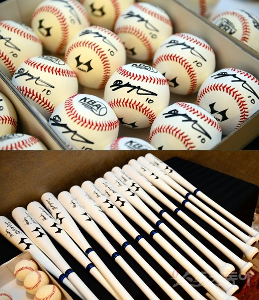 이대호는 투어 참가자들을 위해서 야구공(위)과 배트를 준비하는 세심한 배려를 아끼지 않았다. 후쿠오카｜박화용 기자 inphoto@donga.com 트위터 @seven7sola