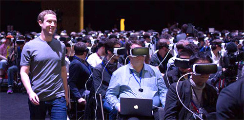 VR 기기를 착용한 청중 옆에서 걷고 있는 마크 저커버그. 마크 저커버그 페이스북