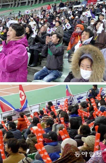 한국과 북한 여자 축구 대표팀이 29일 일본 오사카 얀마 스타디움에서 열린 2016 리우 올림픽 아시아 지역 최종예선에서 
격돌했다. 재일대한민국민단 오사카 지부 중심의 한국 응원단 400여 명은 태극기를 흔들며 응원을 펼쳤다(위쪽 사진). 
재일본조선인총연합회 중심의 북한 응원단 1000여 명은 인공기와 빨간색 응원용 막대기를 흔들며 선수들에게 힘을 보탰다. 
오사카=서영아 특파원 sya@donga.com