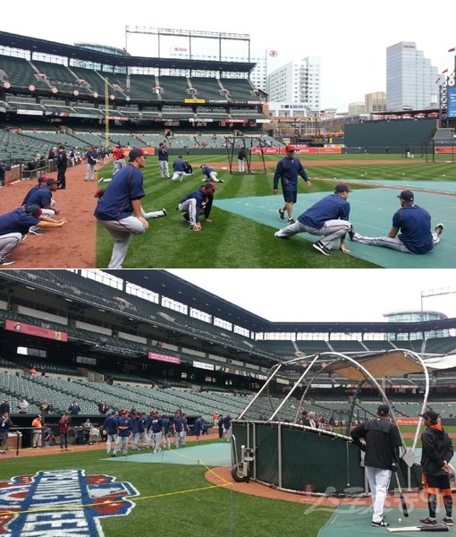 미네소타 박병호(위 사진 가운데)가 5일(한국시간) 오리올파크에서 열린 볼티모어와의 시즌 개막전을 앞두고 스트레칭으로 몸을 풀고 있다. 박병호의 시선은 배팅케이지에서 외롭게 방망이를 휘두르는 김현수(아래 사진 왼쪽)를 계속 향해 있었다. 볼티모어(미국 메릴랜드주)｜김영준 기자  gatzby@donga.com