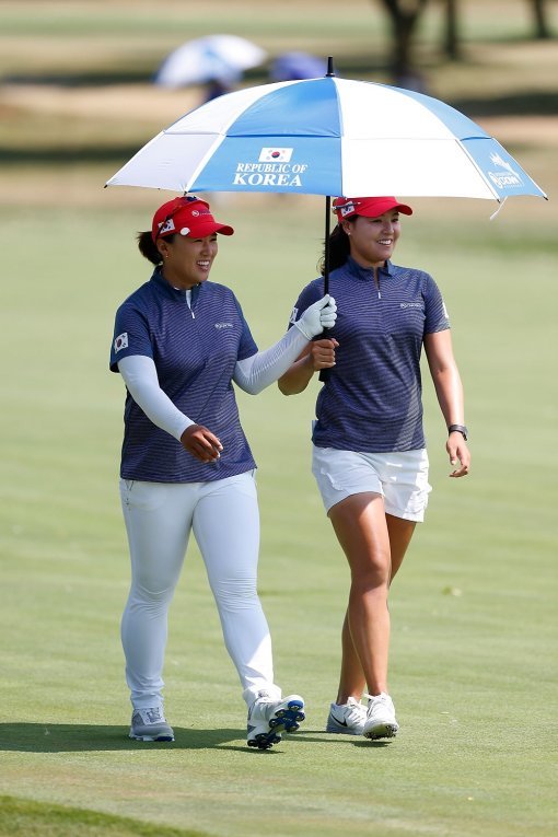 CHICAGO, IL - JULY 21:  (L) Amy Yang and (R) In Gee Chun of Korea walk down the 17th fairway during the four-ball session of the 2016 UL International Crown at the Merit Club on July 21, 2016 in Chicago, Illinois.  (Photo by Matt Sullivan/Getty Images)