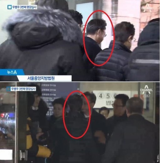 사진=취재진에게 떠밀려 유리창에 어깨를 부딪힌 뒤 취재진을 보려보는 우병우 전 수석(채널A)