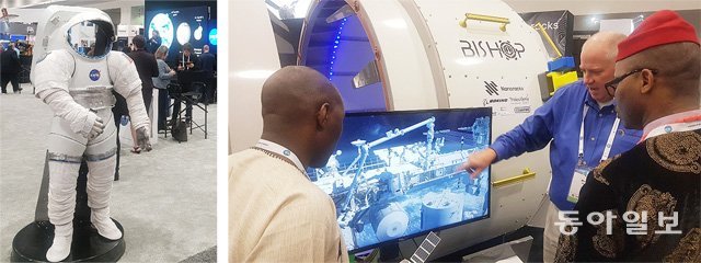 지난달 21일 미국 워싱턴컨벤션센터에서 열린 제70회 세계우주대회 현장. 우주장비업체 ‘나노랙스’의 관계자가 모니터 화면에 우주정거장의 작업 상황을 보여주는 시뮬레이션을 띄워 놓은 채 옆에 설치된 로봇 팔을 통해 우주선의 해치를 여는 과정을 시연하고 있다(오른쪽 사진). 이날부터 5일간 열린 행사에 세계 80여 개국 항공 분야 과학자 및 업계 관계자들이 대거 참석했다. 워싱턴=이정은 특파원 lightlee@donga.com