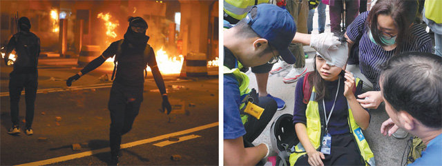 거리는 불타고, 부상자는 속출하고… 14일 홍콩 반중·반정부 시위대가 홍콩섬과 카오룽 반도를 잇는 홍콩
 크로스하버 터널 요금소에 불을 지르고 있다(왼쪽 사진). 이 터널은 시위대가 바리케이드를 설치하고 화염병을 던져 폐쇄됐다. 같은
 날 홍콩 금융가에서 시위 현장을 취재하던 한 기자(오른쪽 사진 가운데)가 부상을 당해 시위대 내 의료진의 도움을 받고 있다. 
다섯 달을 넘긴 홍콩 사태가 시위의 과격화와 경찰의 강경 진압으로 격화되고 있다. 홍콩=AP 뉴시스