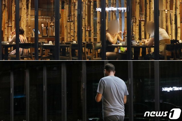 코로나19 확산방지를 위한 수도권 지역의 사회적 거리두기 2.5단계가 시행된 30일 밤 9시가 넘은 시간, 서울 용산구 이태원동 번화가의 한 음식점이 영업을 종료해 불이 모두 꺼져있다(아래). 이 음식점은 저녁식사 시간대에 영업을 했지만 손님이 많지 않은 모습이었다. 2020.8.30 © News1