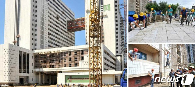 북한 노동당 기관지 노동신문은 13일 평양종합병원 건설장을 조명하며 “현재 외벽 타일 붙이기 공사는 마감 단계에 들어섰다“라고 전했다. (평양 노동신문=뉴스1)