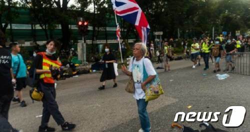 지난해 홍콩 민주화 시위에 참석한 웡. (BBC갈무리)ⓒ 뉴스1