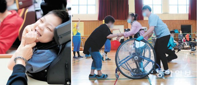 어린이날을 하루 앞둔 4일 서울 마포구 한국우진학교에서 ‘우진 어린이날 큰잔치’가 열리고 있다. 교사가 즉석에서 만들어준 솜사탕을
 먹으며 즐거워하는 학생(왼쪽 사진). 체육관에선 학생들이 휠체어와 보행보조기구를 이용해 계주 경기에 참여했다. 장승윤 기자 
tomato99@donga.com