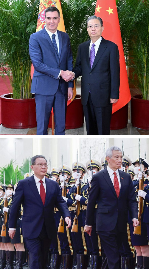 중국은 ‘보아오 포럼’ 등을 계기로 세계 각국 정·재계 리더를 최근 대거 초청했다. 위 사진은 자오러지 중국 전국인민대표대회 
상무위원장(오른쪽)과 페드로 산체스 스페인 총리가 3월 31일 베이징에서 회담한 뒤 기념 촬영을 하는 모습. 아래 사진은 리창 
중국 총리(왼쪽)와 리셴룽 싱가포르 총리가 1일 베이징 인민대회당에서 열린 환영식에서 의장대를 사열하는 모습. 베이징=신화 AP 
뉴시스