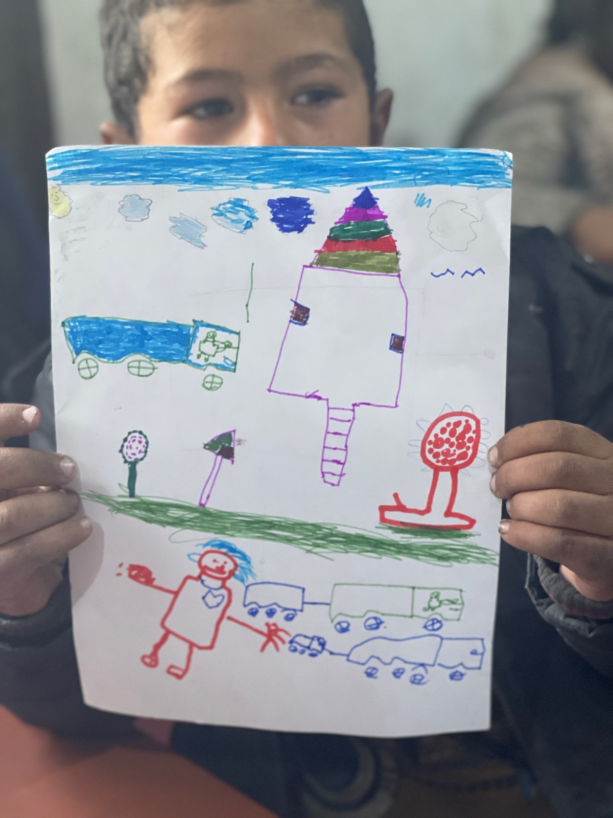 프로그램에 참여한 한 아동이 자신이 기억하는 마을의 모습을 그렸다. 컨선월드와이드 제공