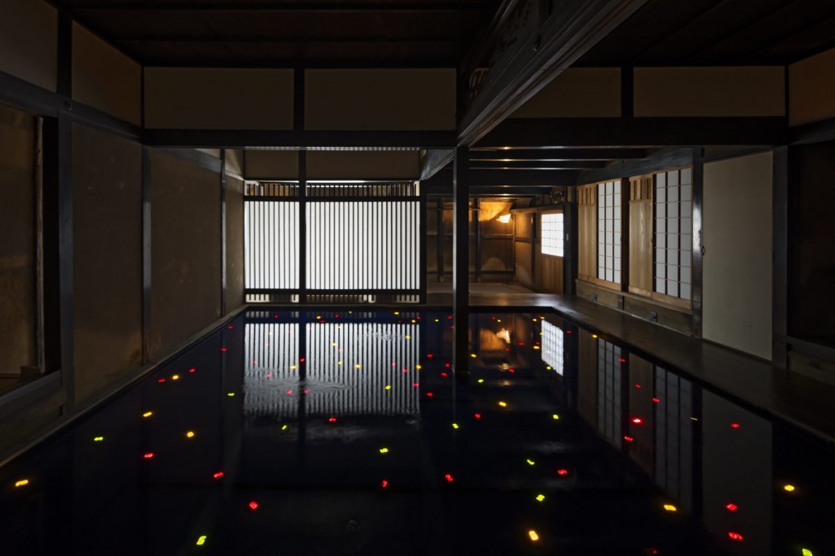 The interior of ‘Kadoya’, the first ‘house project’ underway in Naoshima.  The interior of a 200-year-old abandoned house was renovated to create a huge water tank and floating 250 digital numbers.  The speed at which digital numbers change was left to each of the 250 residents to decide.  Benesse Art Site Naoshima