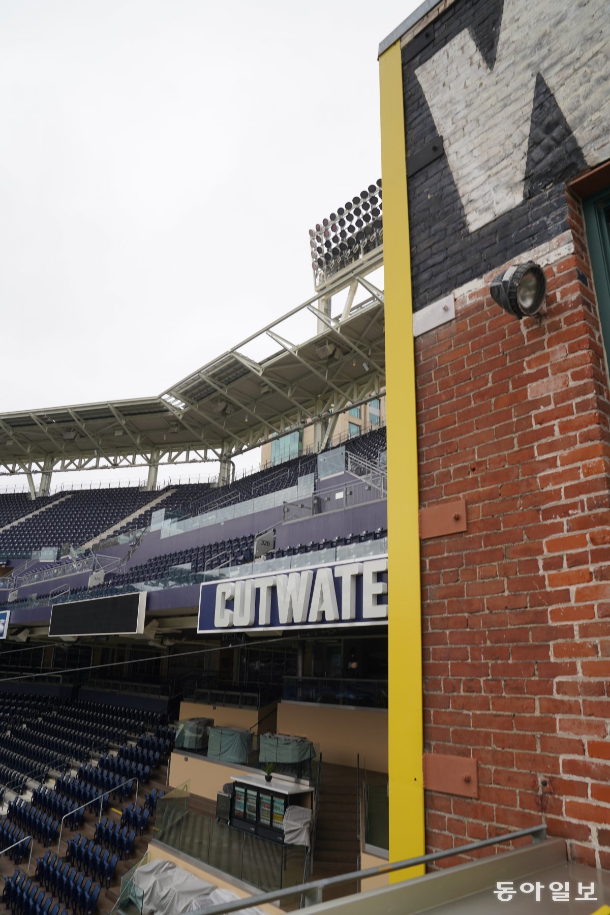 One corner of the Western Metal Company brick building is painted yellow, marking the boundary between home runs and fouls on the left outfield fence.