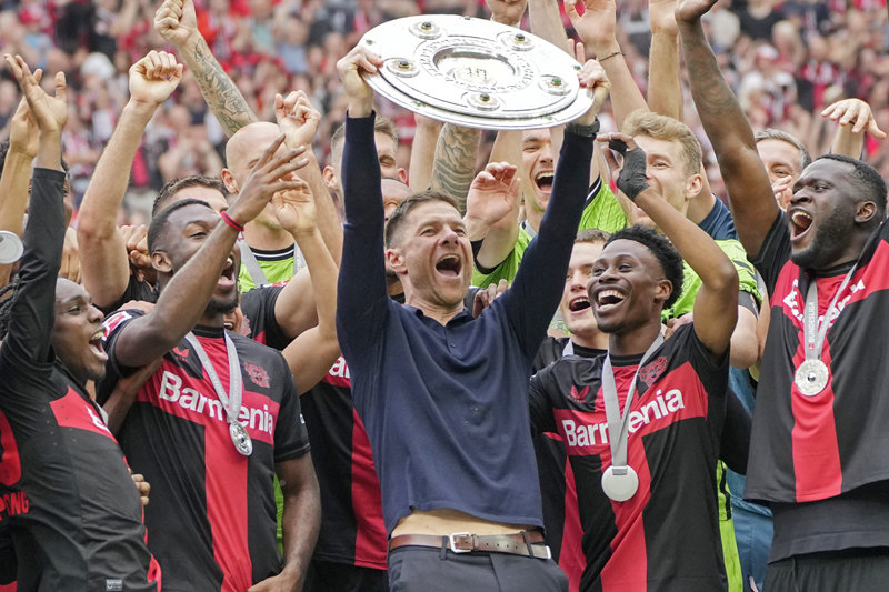 Bayer Leverkusen coach )' and rejoicing with the players. The Meisterschale is a trophy given to the Bundesliga winning team and means ‘winner’s plate’ in German. Leverkusen = AP Newsis