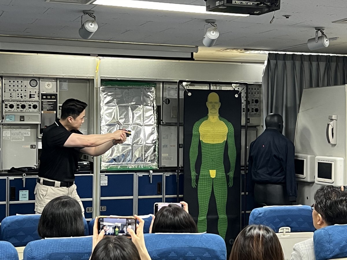 Tasers are fired in the in-flight disorder suppression practice room at the Korean Air cabin training center.