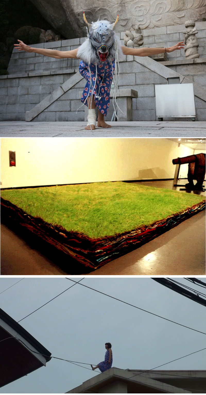 Various works and performances by artist Hong Lee Hyun-sook.  Her first photograph was her performance ‘Sanggasa at Midday’ (2019), in which she faces non-human creatures while wearing an animal mask.  The middle photo is an installation piece called ‘Hidden Energy’ (1998) using old clothes, dirt, and barley seeds.  The third photo shows her performance ‘Menopause Ritual’ (2012), in which she jumped over walls and buildings, interpreting ‘menopause’ as breaking boundaries.  Provided by the author