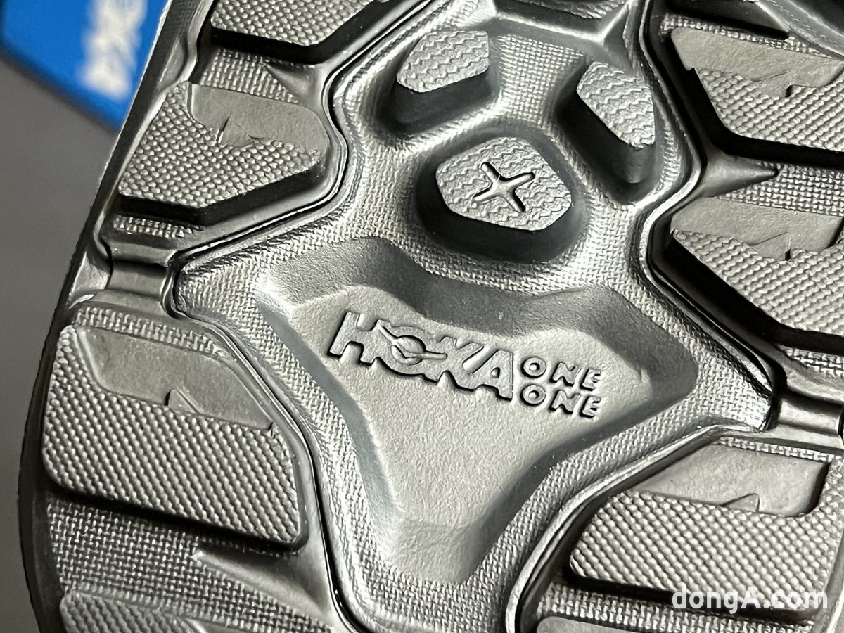 The sole of the Hoka Hopara 2 is engraved with the official brand name, the Hoka One One logo.