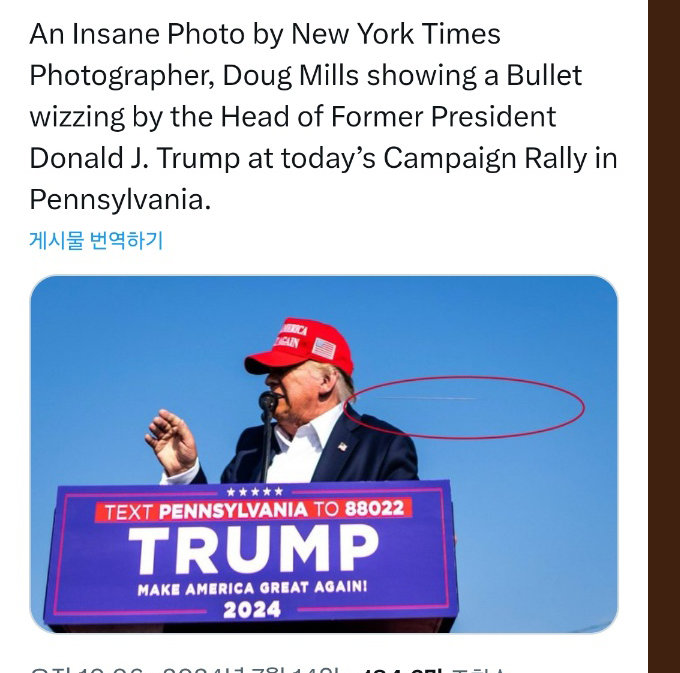 Trump being shot, as captured by New York Times reporter Doug Mill. If you zoom in on the photo, you can see the bullets flowing to the right of the photo.