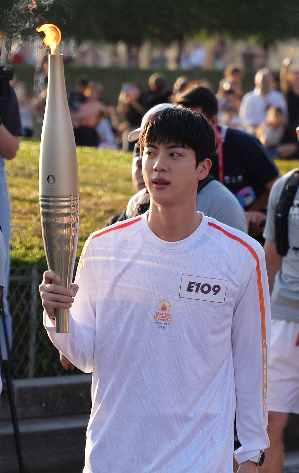 Jin of the group BTS is carrying the torch for the 2024 Paris Summer Olympics in Paris, France on the 14th (local time). (Provided by the 2024 Paris Olympic Organizing Committee) 2024.7.15. News 1