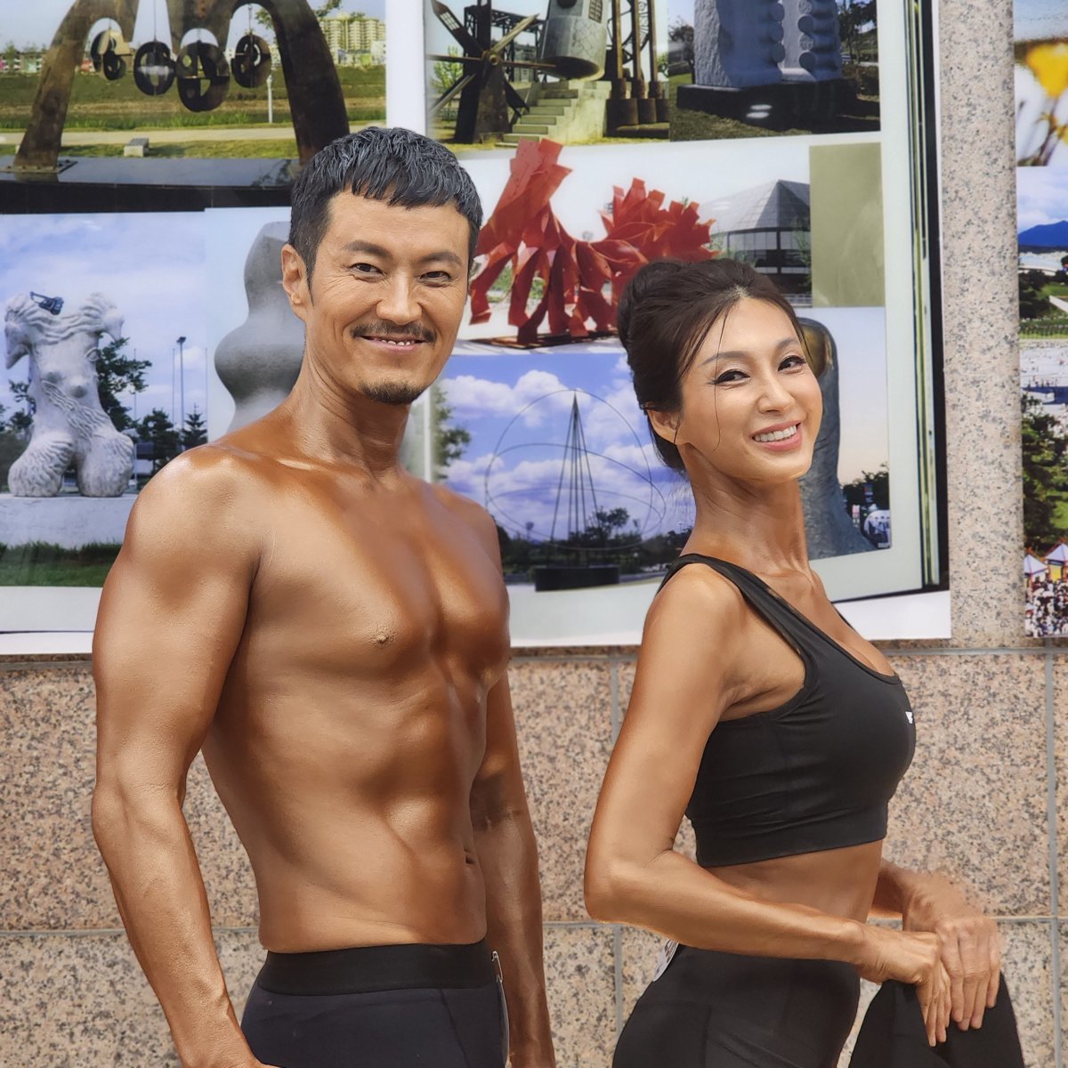 Director Baek Soo-jeong (right) poses with her husband Kim Dae-hoon in the fit model category of the Seoul Wellness Muscle Fitness Championship (WMFC) held at the Seoul Olympic Parktel on July 7. Courtesy of Director Baek Soo-jeong.