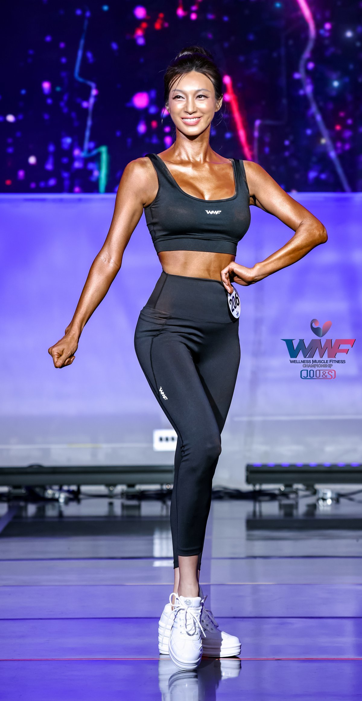 Director Baek Soo-jeong poses while competing in the fit model category of the Seoul Wellness Muscle Fitness Championship (WMFC) held at the Seoul Olympic Parktel on July 7. Courtesy of Director Baek Soo-jeong.