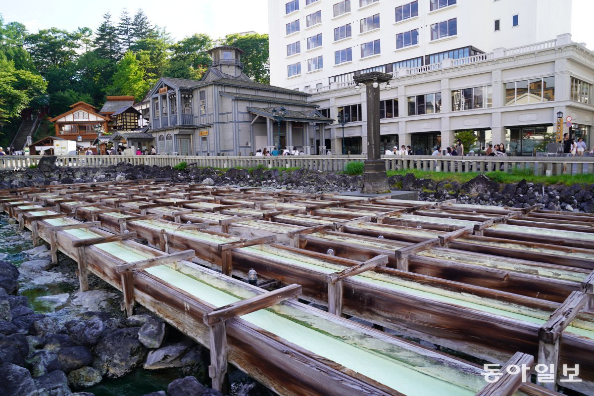 A wooden water channel shaped like a terraced rice field at Yubatake in Kusatsu Onsen Village, Gunma Prefecture.