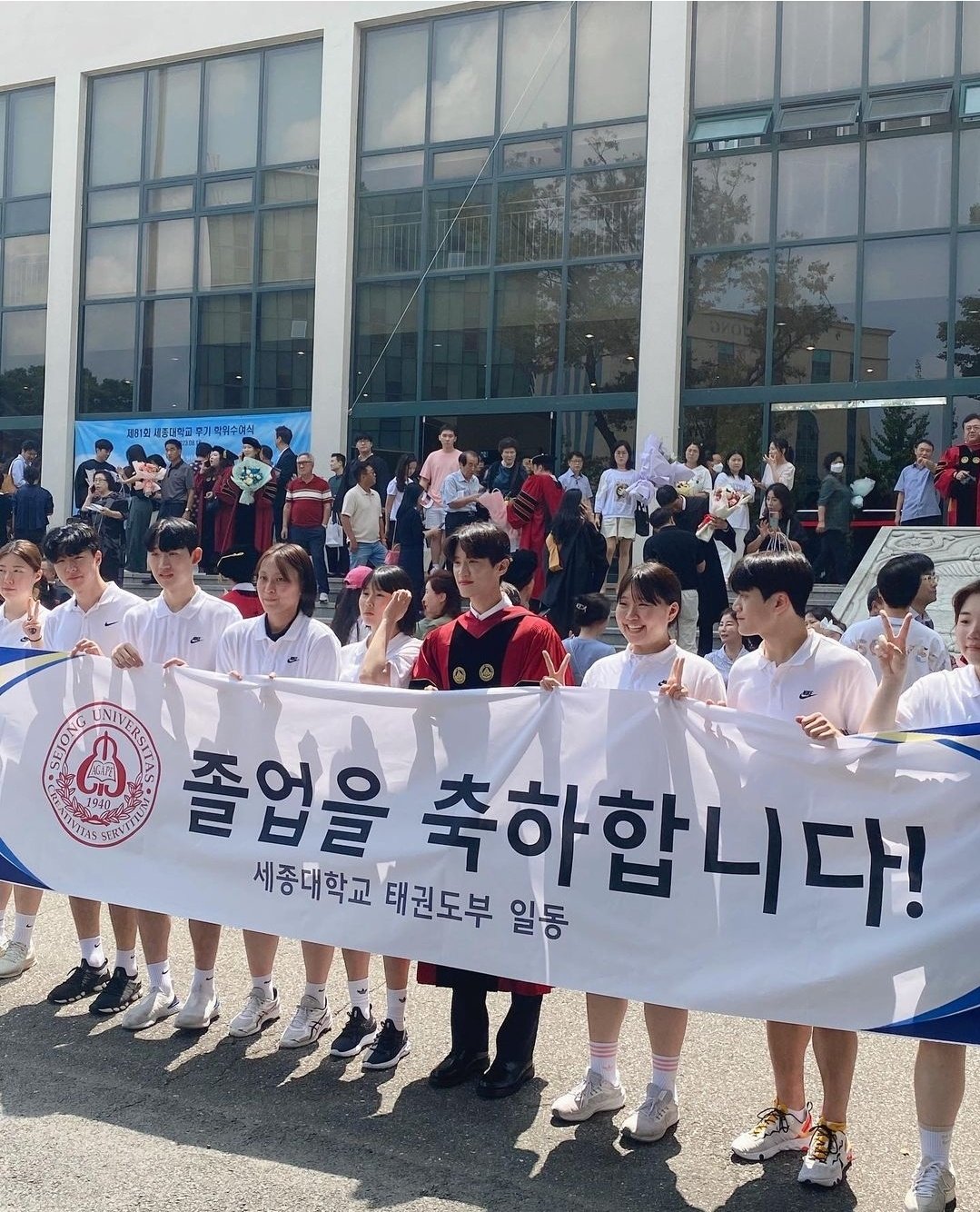 Lee Dae-hoon (center) received his doctorate from Sejong University last year. Courtesy of Lee Dae-hoon