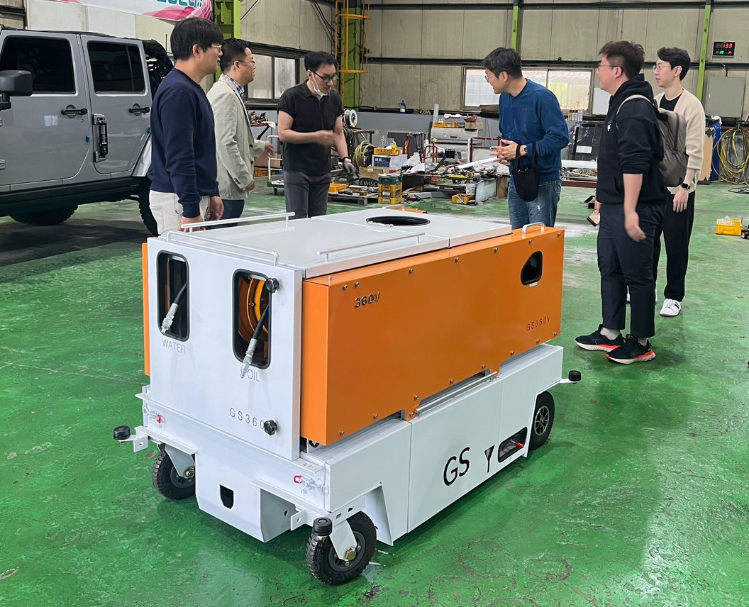 Testing the performance of a towable fire suppression device in April of this year. The device in the photo is a model in the mid-development stage. Courtesy of Remobility