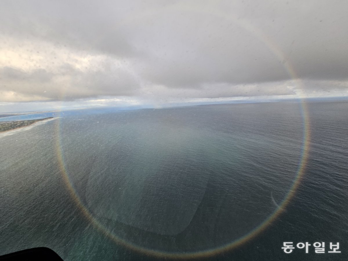 A circular rainbow taken from a helicopter on the Great Ocean Road.