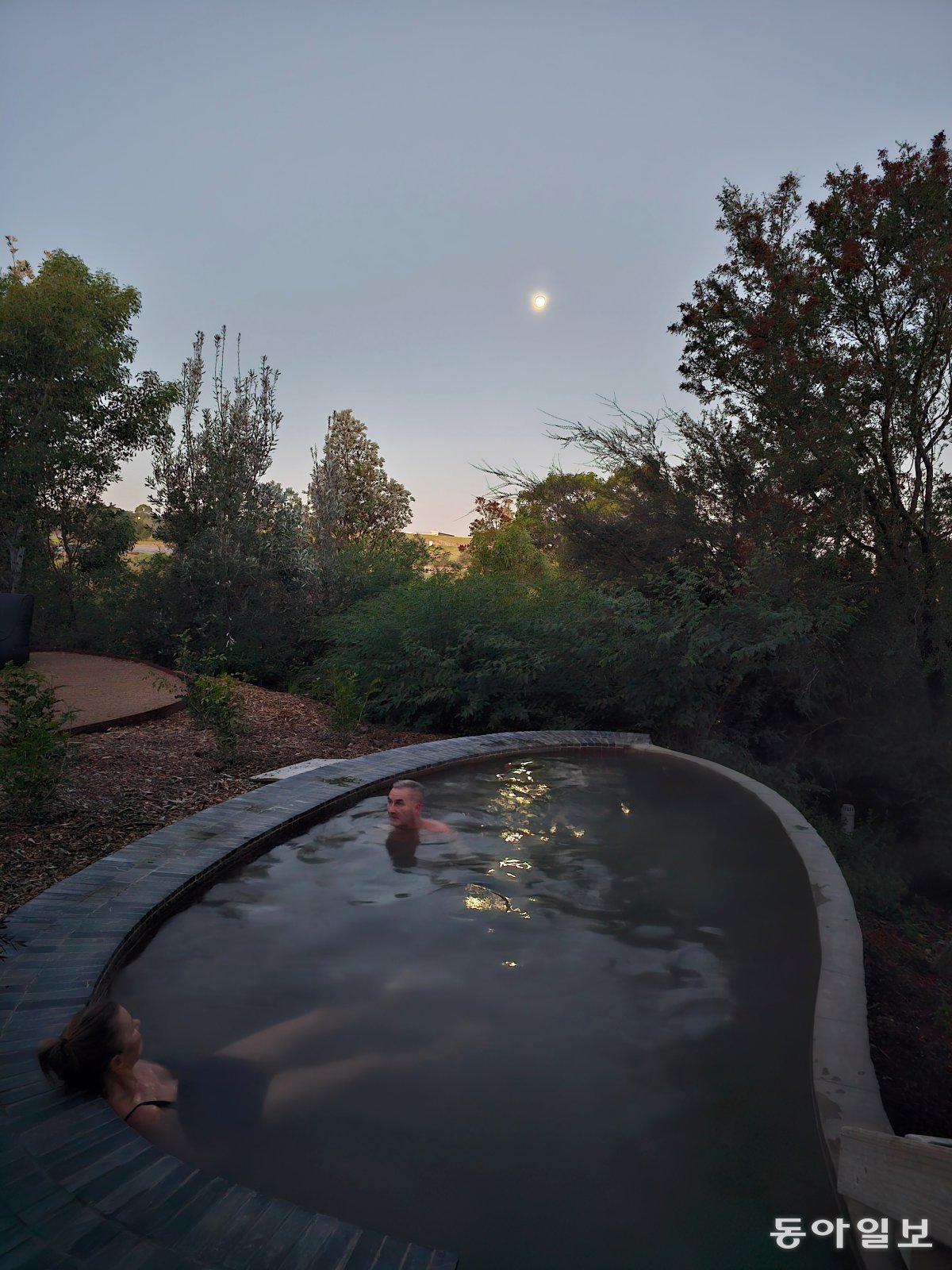 Enjoy the Miteng Hot Springs outdoors under the moonlight.