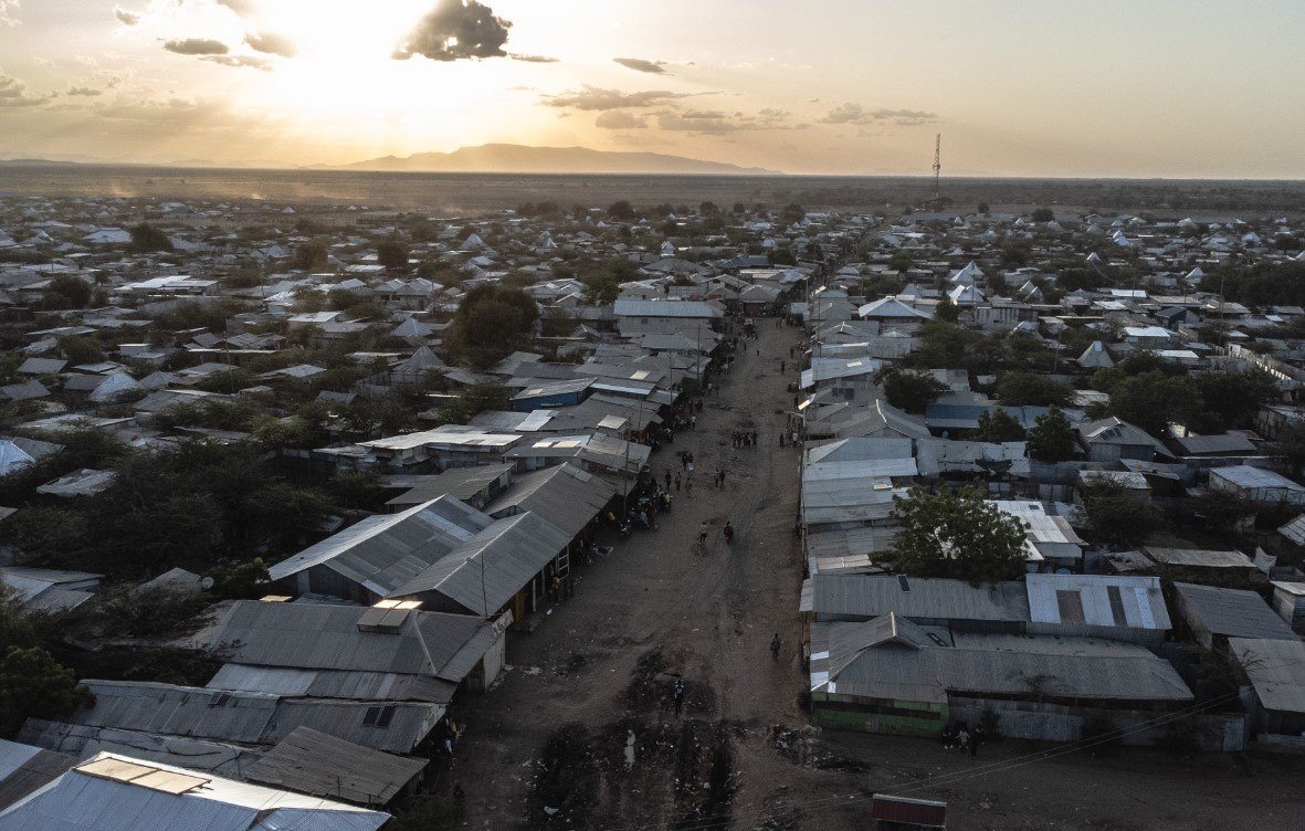 An aerial view of a refugee camp in Kenya in January. Square solar panels can be seen on the roofs. Inexpensive solar panels are now lighting up African businesses and factories, as well as small huts without electricity. AP News